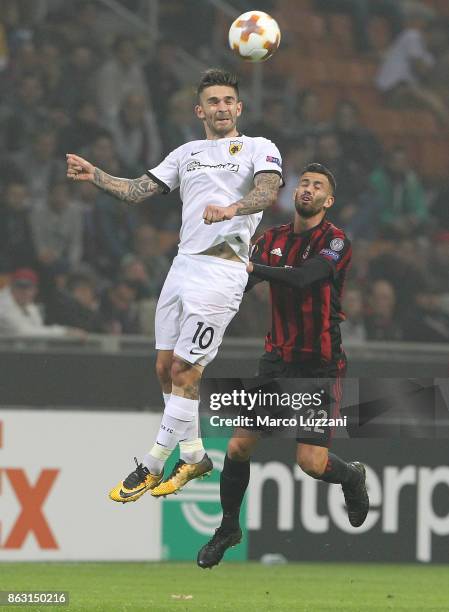 Marko Livaja of AEK Athens competes for the ball with Mateo Musacchio of AC Milan during the UEFA Europa League group D match between AC Milan and...