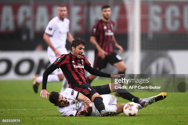 S midfielder Lazaros Christodoulopoulos from Greece fights for the ball with AC Milan's midfielder Manuel Locatelli during the UEFA Europa League...