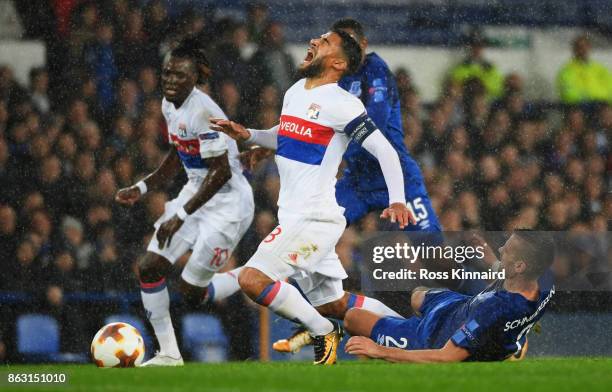 Nabil Fekir of Lyon is challenged by Morgan Schneiderlin of Everton during the UEFA Europa League Group E match between Everton FC and Olympique Lyon...