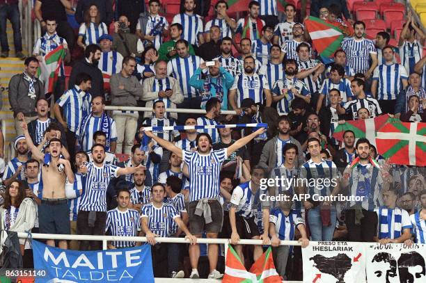 Fans of Real Sociedad cheer for their team during the UEFA Europa League Group L football match between FK Vardar and Real Sociedad at the Filip II...