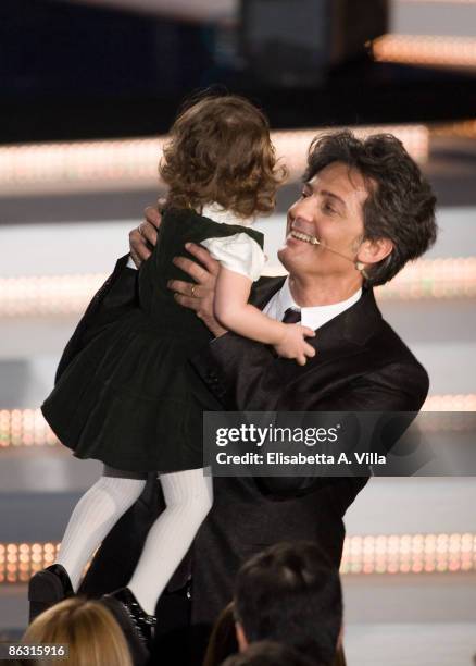 Rosario Fiorello embraces his daughter Angelica during the TV show 'Fiorello Show' at Teatro Tenda Clodio on April 1, 2009 in Rome, Italy.