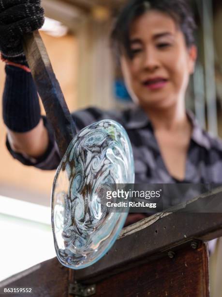japanese woman working in glass blowing factory - glass blowing stock pictures, royalty-free photos & images