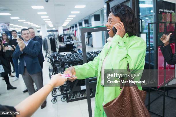 The first customer arrives at Saks OFF 5th Seattle after the Official Ribbon Cutting on October 19, 2017 in Seattle, Washington.