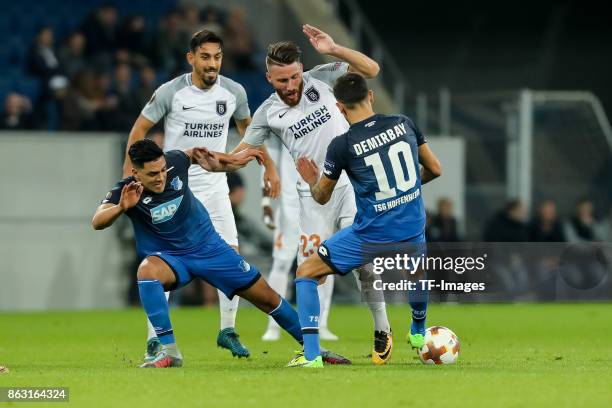 Nadiem Amiri of Hoffenheim, Kerem Demirbay of Hoffenheim and Tunay Torun of Istanbul Basaksehir battle for the ball during the UEFA Europa League...