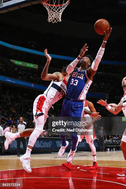 Robert Covington of the Philadelphia 76ers shoots the ball against the Washington Wizards on October 18, 2017 at Capital One Arena in Washington, DC....