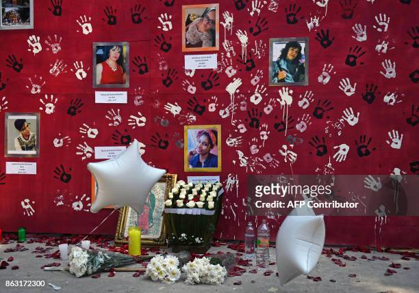 View on a makeshift altar for the victims of Mexico's September 19 earthquake, during a tribute in their memory in front of a collapsed building at...