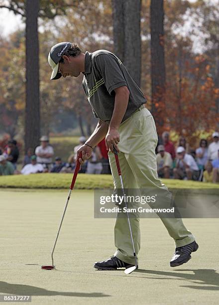 Sergio Garcia on the 11th green with his broken putter and wedge during the third round of THE TOUR Championship at East Lake Golf Club in Atlanta,...