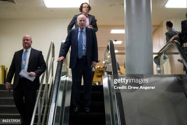 Sen. John McCain heads back to his office following a vote on amendments to the fiscal year 2018 budget resolution, on Capitol Hill, October 19, 2017...