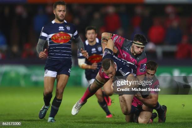 Alban Conduche of Agen is tackled by Henry Trinder and Lewis Ludlow of Gloucester during the European Rugby Challenge Cup Pool 3 match between...