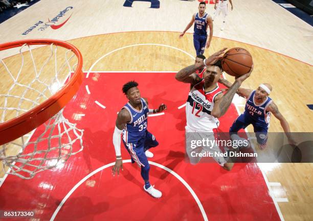 Kelly Oubre Jr. #12 of the Washington Wizards drives to the basket against the Philadelphia 76ers on October 18, 2017 at Capital One Arena in...