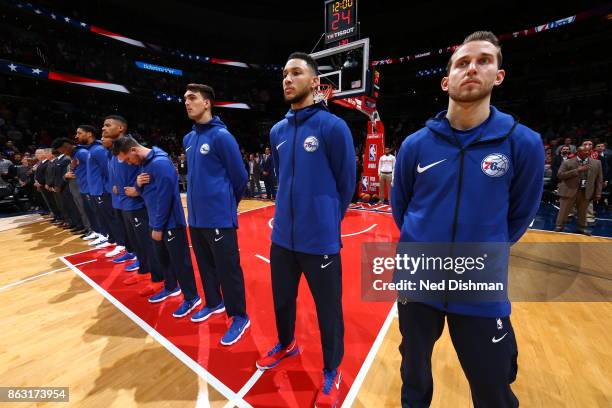 The Philadelphia 76ers during the national anthem before the game against the Washington Wizards on October 18, 2017 at Capital One Arena in...