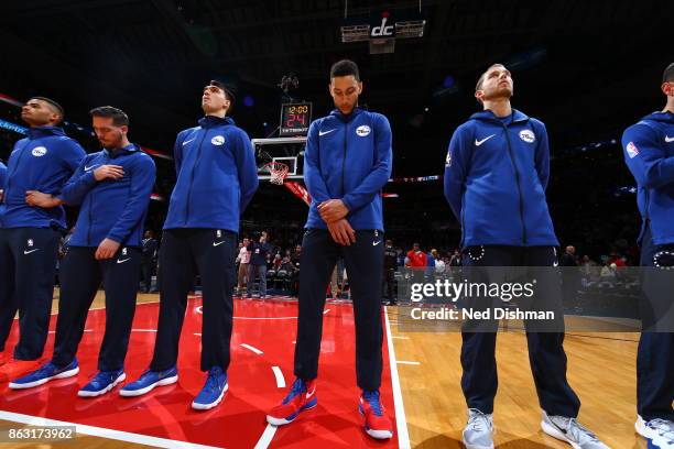 The Philadelphia 76ers during the national anthem before the game against the Washington Wizards on October 18, 2017 at Capital One Arena in...