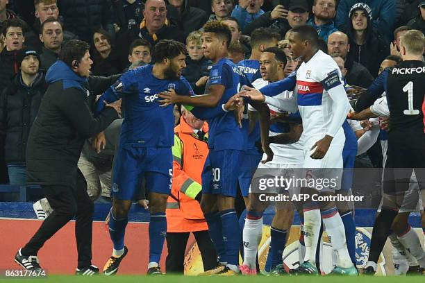 Everton's English-born Welsh defender Ashley Williams is kept apart as players clash during the UEFA Europa League Group E match between Everton and...