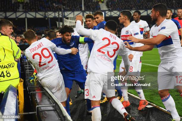 Ashley Williams of Everton clashes with Lyon players after a challenge on Anthony Lopes of Lyon during the UEFA Europa League Group E match between...