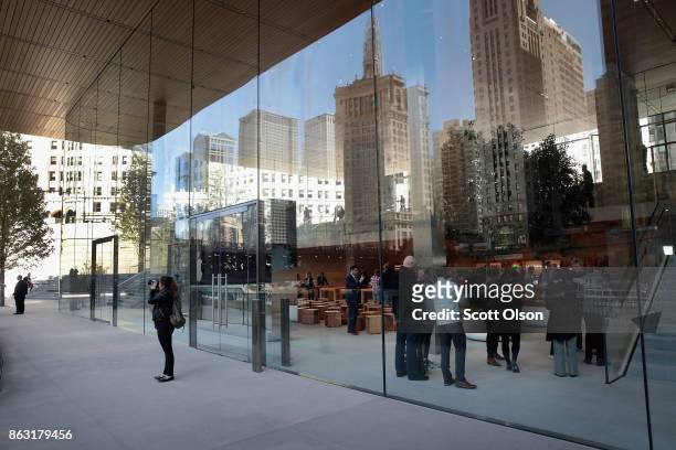 Apple previews it newest store located on Michigan Avenue along the Chicago River on October 19, 2017 in Chicago, Illinois. The glass-sided store...