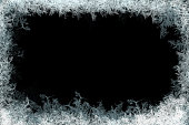 Decorative ice crystals frame on black matte background