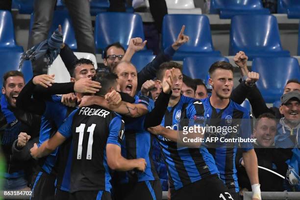 Atalanta's Swiss midfielder Remo Freuler celebrates after scoring the third goal during the UEFA Europa League group E football match Atalanta vs...
