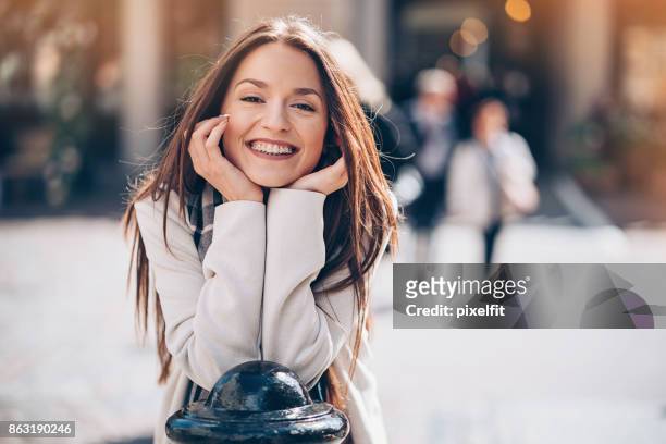 beautiful smiling woman with braces - braces imagens e fotografias de stock