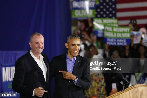 Former U.S. President Barack Obama stands on stage with Democratic candidate Phil Murphy, who is running against Republican Lt. Gov. Kim Guadagno for...