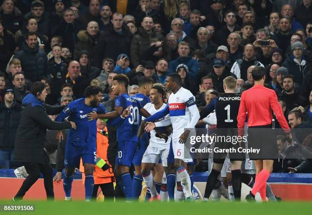 Ashley Williams of Everton is restrained as he clashes with Lyon players after a challenge on Anthony Lopes of Lyon during the UEFA Europa League...