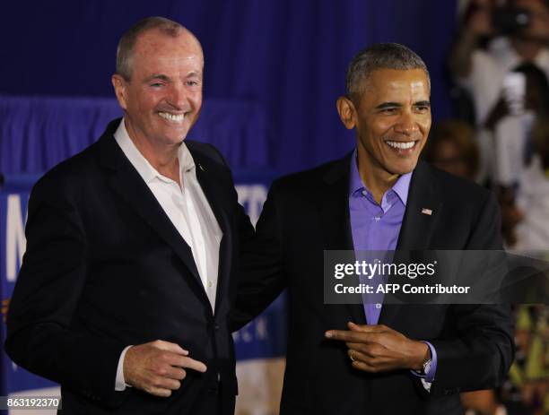 Former US President Barack Obama campaigns for New Jersey Democratic gubernatorial candidate Phil Murphy in Newark, New Jersey on October 19, 2017. /...