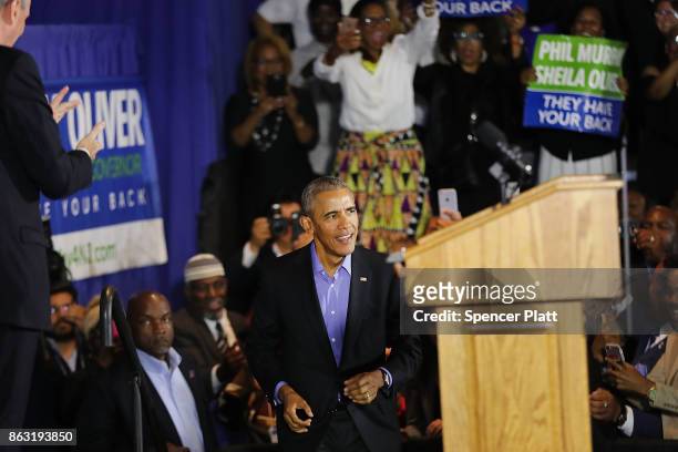 Former U.S. President Barack Obama walks onto stage at a rally in support of Democratic candidate Phil Murphy, who is running against Republican Lt....
