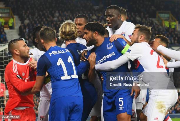 Ashley Williams of Everton clashes with Lyon players after a challenge on Anthony Lopes of Lyon during the UEFA Europa League Group E match between...