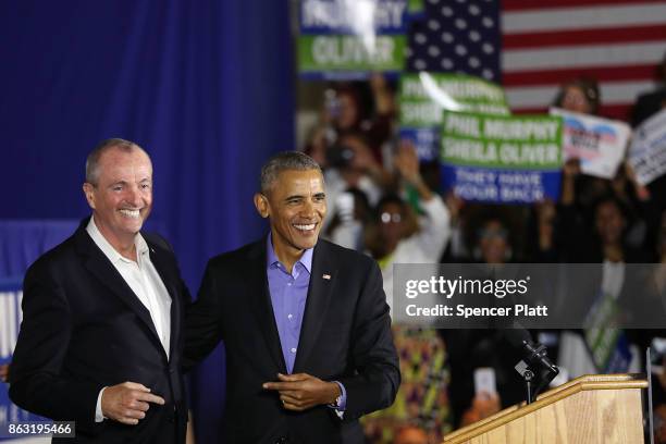 Former U.S. President Barack Obama stands on stage with Democratic candidate Phil Murphy, who is running against Republican Lt. Gov. Kim Guadagno for...