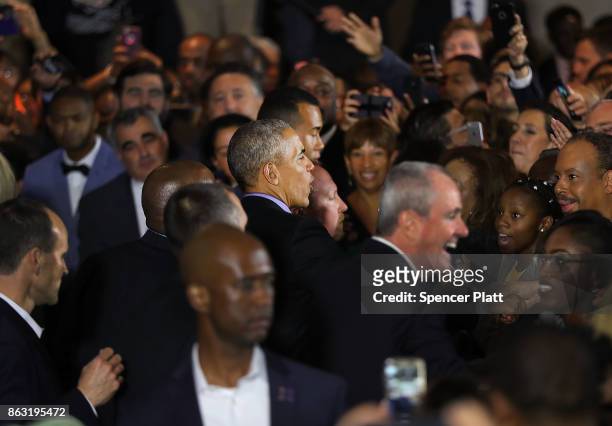 Former U.S. President Barack Obama shakes hands after speaking at a rally in support of Democratic candidate Phil Murphy, who is running against...