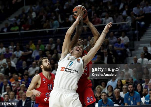 Luka Doncic of Real Madrid vies with Will Clyburn of CSKA Moscow during the Turkish Airlines Euroleague basketball match between Real Madrid and CSKA...