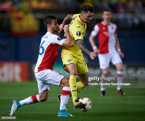 Bruno Soriano of Villarreal competes for the ball with Jakub Hromada of Slavia Praha during the UEFA Europa League group A match between Villarreal...