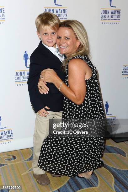 Melanie Wayne and son Charles Bush attend John Wayne Cancer Institute Auxiliary honoring Sheryl A. Ross, MD with The Angel Award at the Beverly...