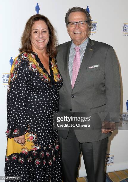 Chairman Patrick Wayne and JWCI auxiliary president Anita Swift attend John Wayne Cancer Institute Auxiliary honoring Sheryl A. Ross, MD with The...