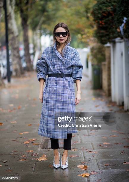 Maria Hatzistefanis wearing checked Off-White coat, Alyx belt, white Balanciaga shoes, Celine sunglasses on October 19, 2017 in London, England.