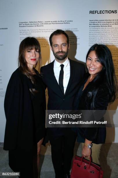 Caroline Nielsen, Benjamin Millepied and singer Anggun attend the Art Exhibition Reflexion Redux of Benjamin Millepied and Barbara Kruger at Studio...