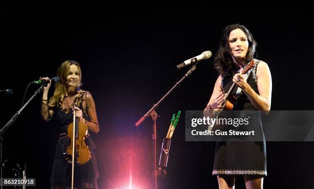 Sharon Corr and Andrea Corr of The Corrs perform on stage at the Royal Albert Hall on October 19 in London, England.