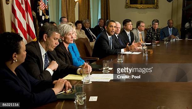 President Barack Obama speaks to his cabinet as Secretary of Defense Robert Gates, Energy Secretary Steven Chu , Commerce Secretary Gary Locke,...