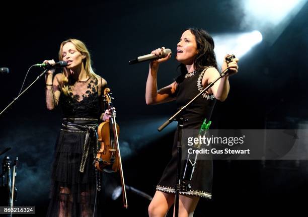 Sharon and Andrea Corr of The Corrs performs on stage at the Royal Albert Hall on October 19 in London, England.