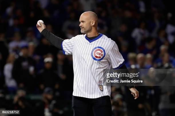 Former Chicago Cubs player David Ross throws out a ceremonial first pitch before game five of the National League Championship Series between the Los...