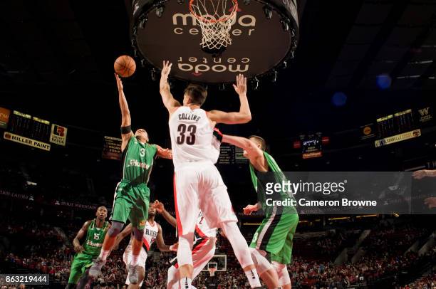 Angel Rodriguez of the Maccabi Haifa shoots the ball during the preseason game against the Portland Trail Blazers on October 13, 2017 at the Moda...