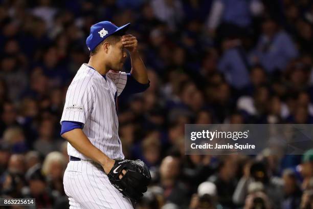 Jose Quintana of the Chicago Cubs reacts in the third inning against the Los Angeles Dodgers during game five of the National League Championship...