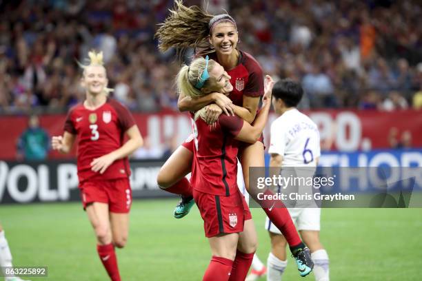 Julie Ertz of the USA celebrates after scoring a goal with Alex Morgan of the USA against the Korea Republic at the Mercedes-Benz Superdome on...