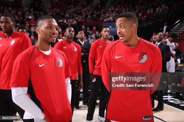 Damian Lillard of the Portland Trail Blazers and CJ McCollum of the Portland Trail Blazers chat before the preseason game against the Maccabi Haifa...