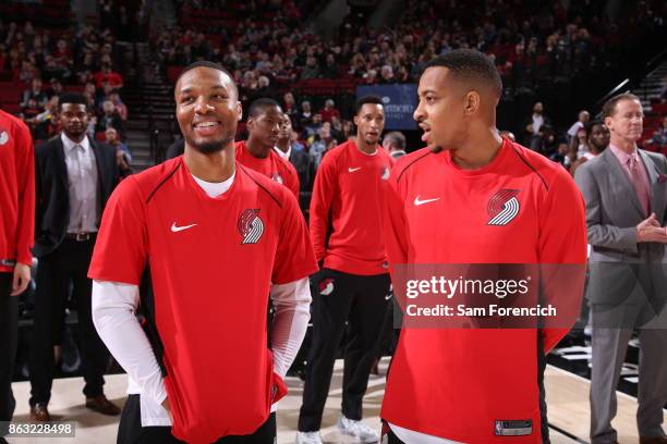 Damian Lillard of the Portland Trail Blazers and CJ McCollum of the Portland Trail Blazers chat before the preseason game against the Maccabi Haifa...