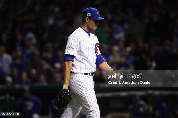 Jose Quintana of the Chicago Cubs walks off the field after being relieved in the third inning against the Los Angeles Dodgers during game five of...