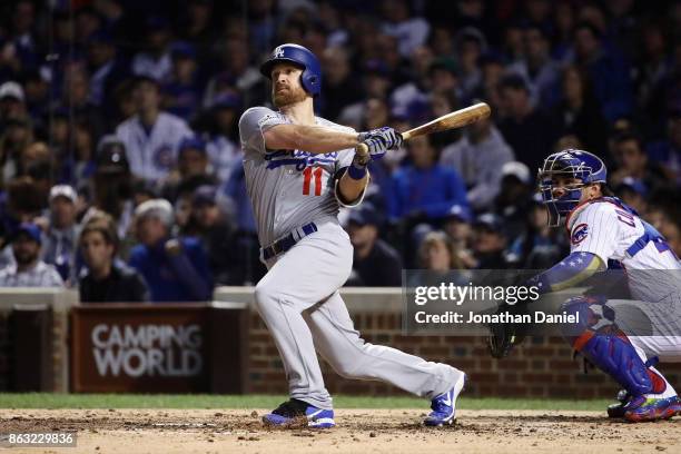 Logan Forsythe of the Los Angeles Dodgers hits a double in the fourth inning against the Chicago Cubs during game five of the National League...