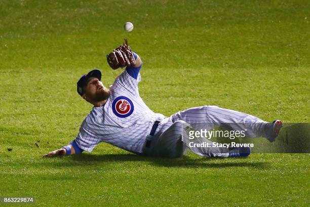 Ben Zobrist of the Chicago Cubs fails to catch a fly ball in the fourth inning against the Los Angeles Dodgers during game five of the National...