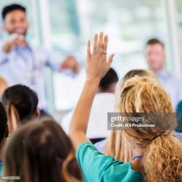 Hand Raises Close Adult Learning Classroom Raise Hand Photos and Premium High Res ...