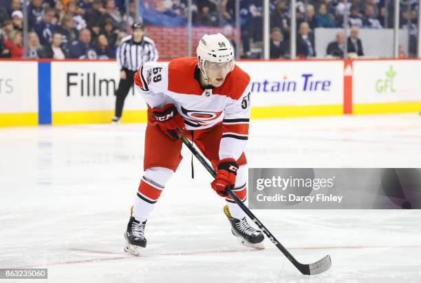 Janne Kuokkanen of the Carolina Hurricanes gets set for a third period face-off against the Winnipeg Jets at the Bell MTS Place on October 14, 2017...