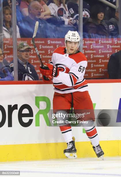 Janne Kuokkanen of the Carolina Hurricanes keeps an eye on the play during third period action against the Winnipeg Jets at the Bell MTS Place on...